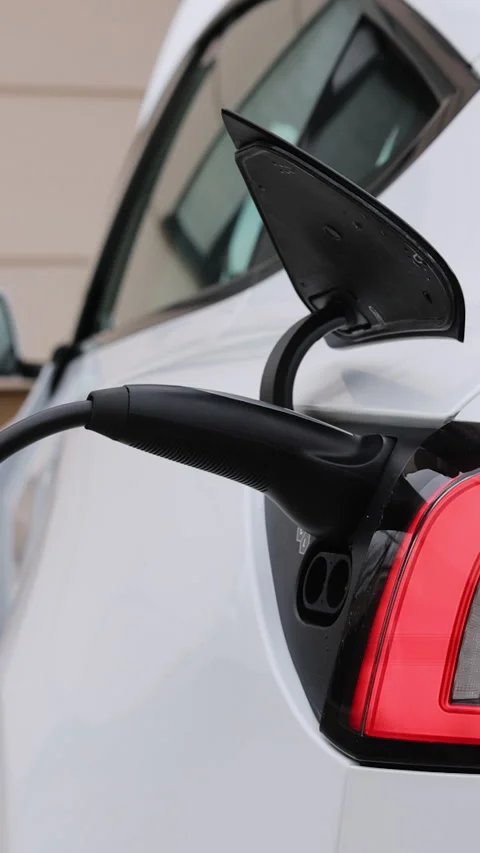 Vertical Format Video of Electric car charging. Electric vehicle charging port Stock Footage 306667361