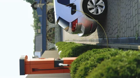 Vertical format video of electric vehicle parking at the charging station Stock Footage 200835310