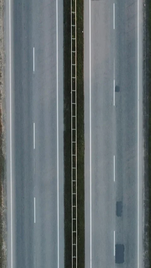 Vertical Format Video of Empty endless autobahn road. Two sided double way Stock Footage 302647983