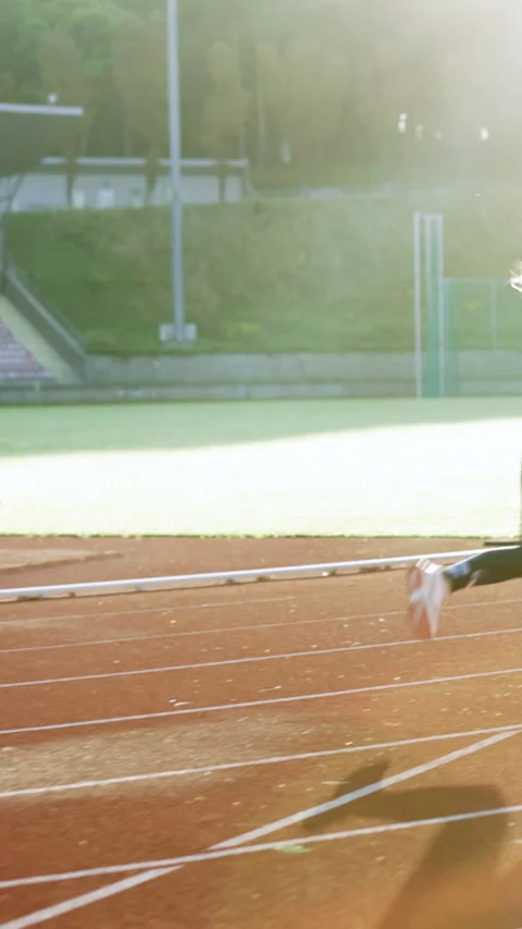 Vertical Format Video of Female marathon runner on professional sports arena Stock Footage 304827424