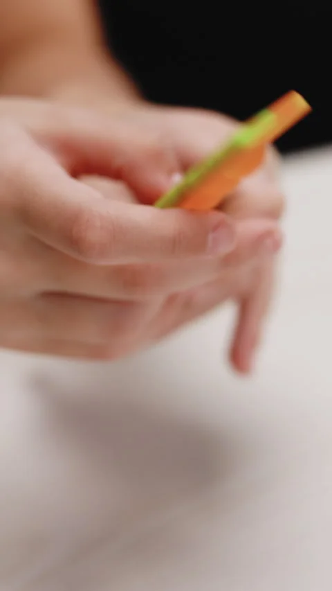 Vertical Format Video of Girl play with simple dimple relaxing toys and pop it Stock-Footage 304901062