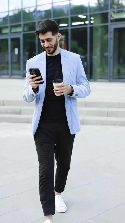 Vertical Format Video of gorgeous bearded businessman using mobile phone for Stock Footage 305861586
