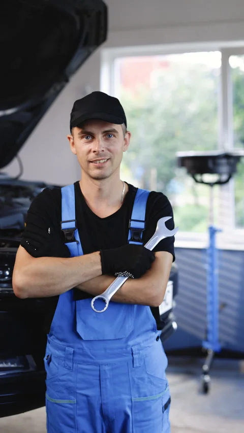 Vertical Format Video of handsome caucasian young man in blue uniform smiling to Stock Footage 305184008