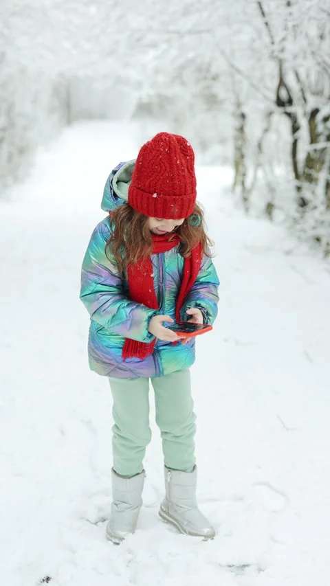 Vertical Format Video of Happy cute little kid girl use smart phone funny face Stock Footage 304910403