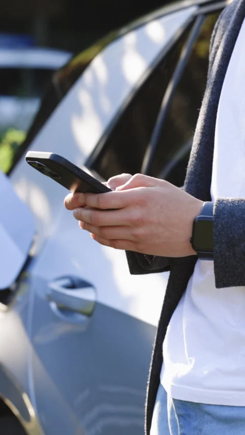 Vertical Format Video of Plug charging an Electric car from charging station Stock Footage 306612801