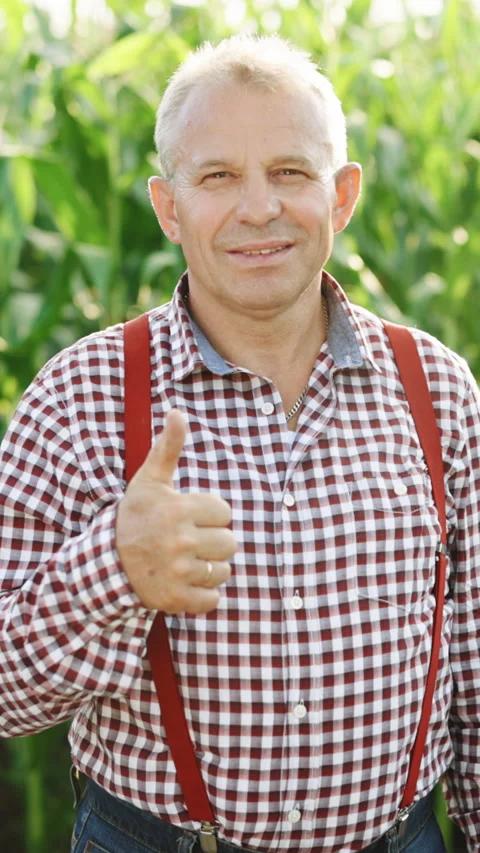 Vertical Format Video of Portrait of attractive caucasian senior man standing in Stock Footage 304041441