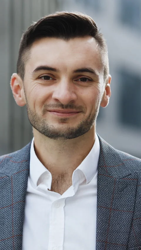 Vertical Format Video of portrait handsome businessman standing look at camera Stock Footage 302803846