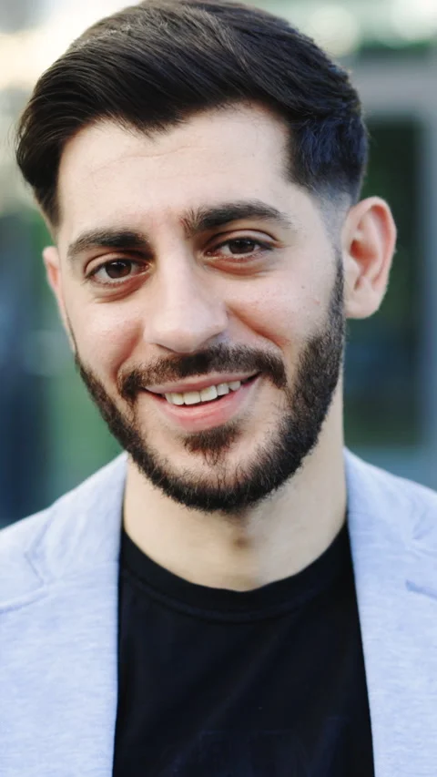 Vertical Format Video of Portrait of happy bearded man looks to the camera and Stock Footage 305864274