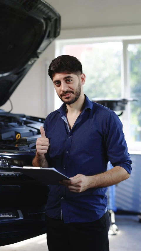 Vertical Format Video portrait of professional automotive mechanic or technician Stock Footage 305177215