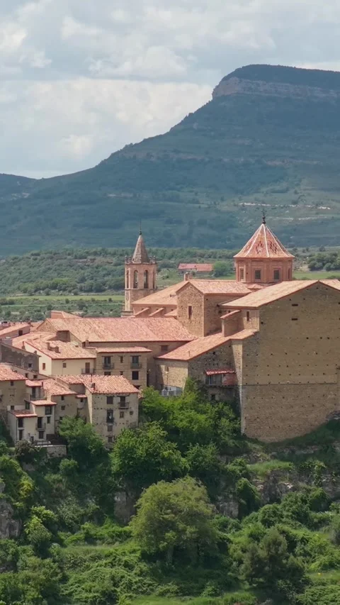 Vertical format video showing a detailed aerial view of Cantavieja, Spain. The Stock Footage 346659361