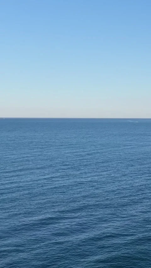 Vertical format video showing a wide expanse of the Mediterranean Sea under a Stock Footage 346633830