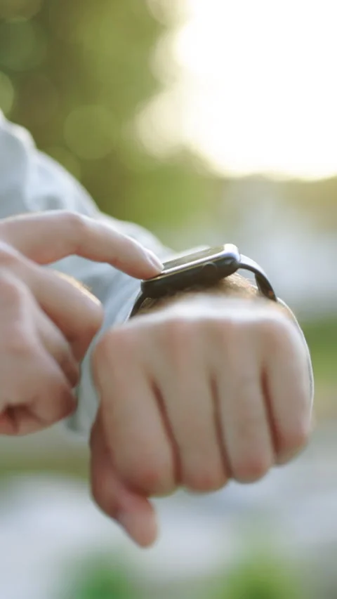 Vertical Format Video of Smart watch. Smart watch on a man's hand outdoor. Man's Stock Footage 305862447
