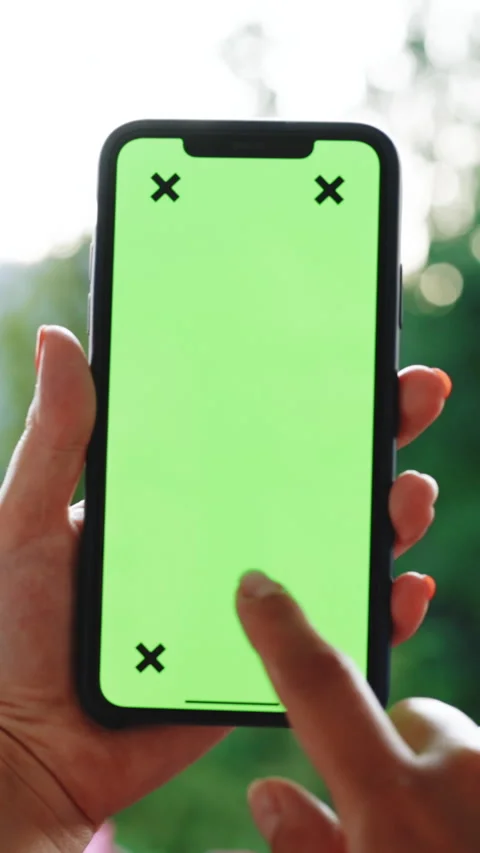 Vertical Format Video of Woman's hand holding mobile telephone with vertical Stock Footage 303972928