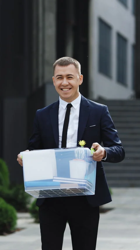 Vertical Format Video of Young happy businessman returns to work after vacation Stock Footage 302803872