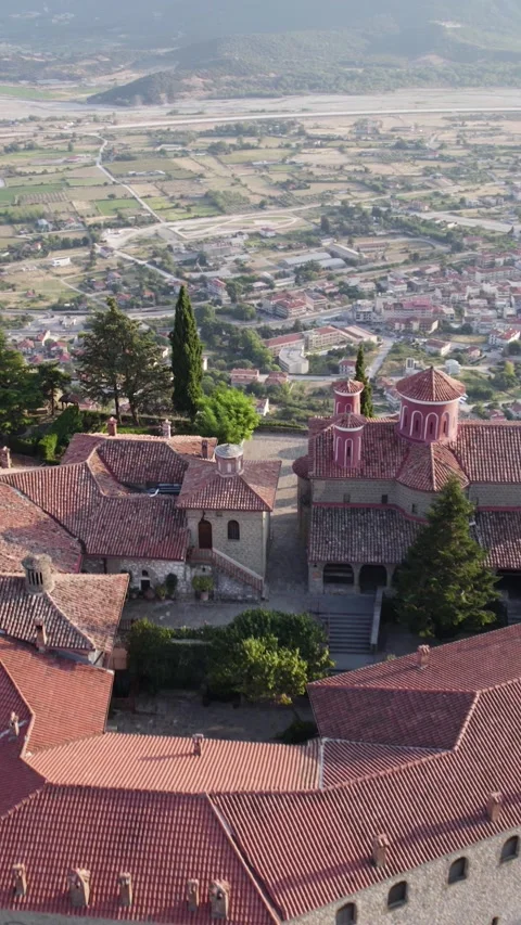 Vertical Forward Aerial of Monastery with Meteora City View Stock Footage 322592490