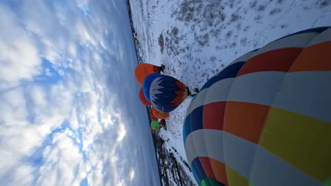 Vertical FPV 4k Aerial View of Colorful Hot Air Balloons Parachutes on Stock Footage 194555439