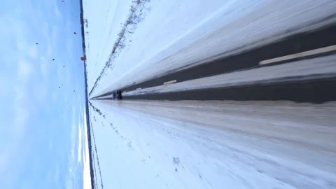 Vertical FPV Drone Aerial View, Tracking Car on Road on Cold Winter Day Stock Footage 194555279