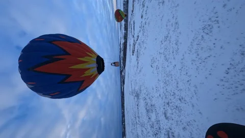 Vertical FPV Drone Aerial View of Colorful Hot Air Balloon Flying Above Stock Footage 195101808