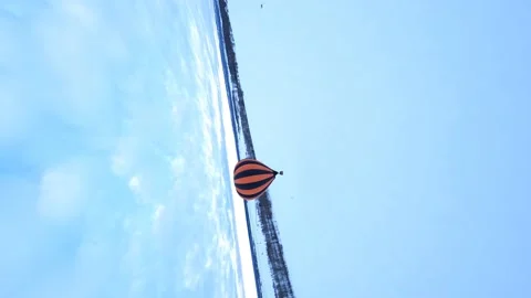 Vertical, FPV Drone Aerial View of Hot Air Balloon in White Winter Stock Footage 195461553