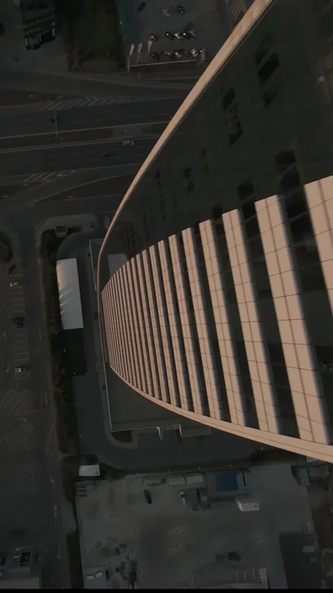 Vertical FPV drone dive along modern skyscraper and boulevard in Sofia, Bulgaria Stock Footage 340814104