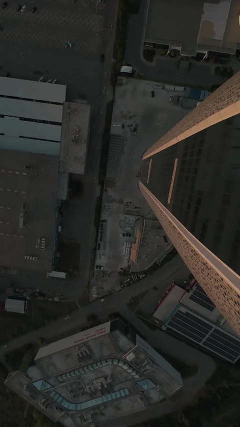 Vertical FPV drone dive from modern skyscraper rooftop in Sofia, Bulgaria. Stock Footage 340814338