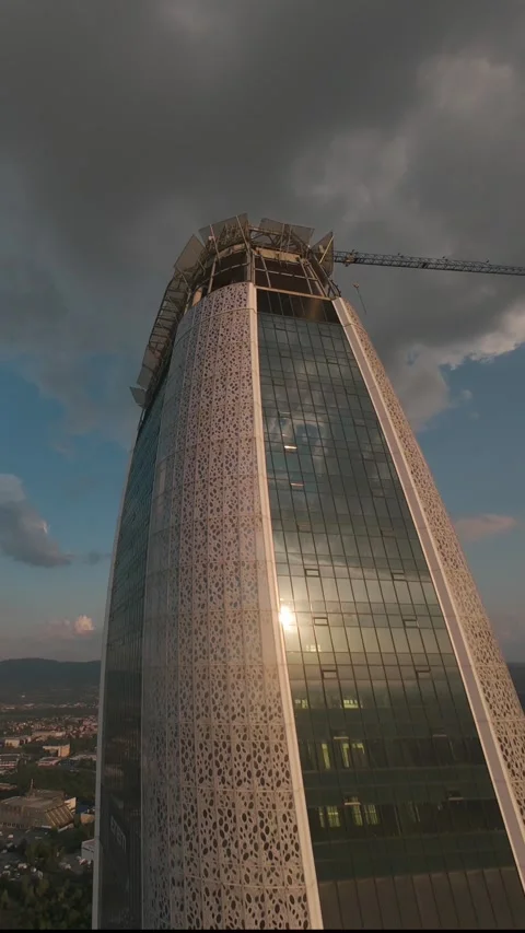 Vertical FPV drone flight ascending along modern skyscraper in Sofia, Bulgaria. Stock Footage 340814119