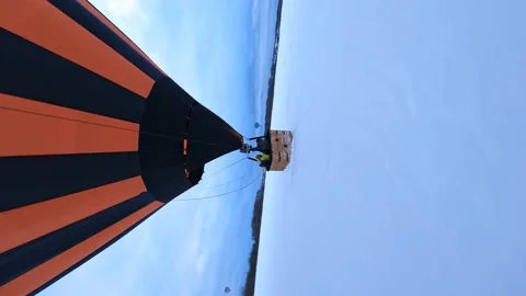 Vertical FPV Drone Shot, Hot Air Balloon Basket in a Snow Preparing to Stock Footage 194555252