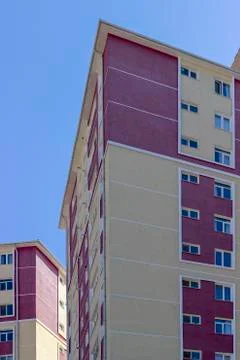 Vertical frame of concrete colorful structured mass housing building Stock Photos
