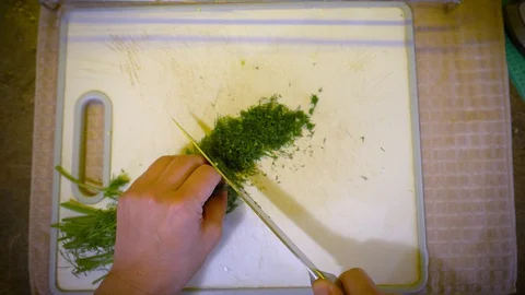 Vertical frame for cutting dill with knife for salad Video stock 129137229