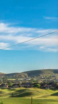 Vertical frame Golf course and houses on a residential area with fence in the Stock Photos