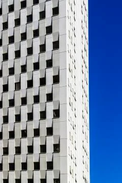 Vertical frame of high rise office building white color facade Stock Photos