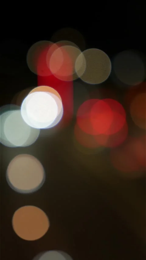 Vertical frame with red and white vehicle lights and street lamps rendered as Stock-Footage 331445782