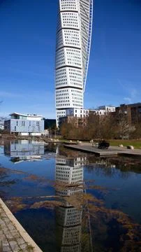 Vertical frame of Turning Torso reflected in sea canal in Malmo, Sweden Stock Photos