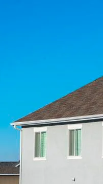 Vertical frame Upstairs windows in a double storey house Stock Photos