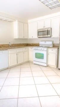 Vertical frame White bright kitchen and countertops Stock Photos