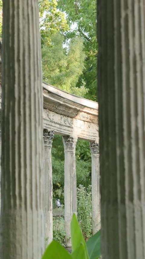 Vertical Framing View Through Corinthian Columns Towards Classical Park Colonnad Stock Footage 340477155