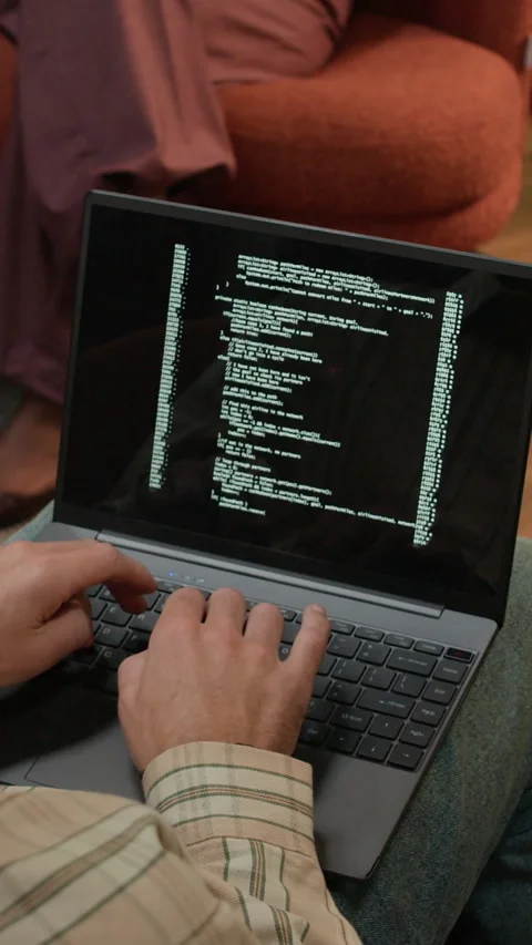 Vertical of Freelance Developer Coding on Laptop in Coworking Space Stock Footage 319994554