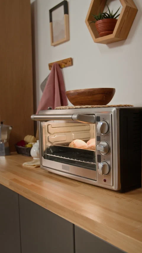 Vertical of Fresh Bread Buns Baking in Electric Oven on Kitchen Counter Stock Footage 340339568