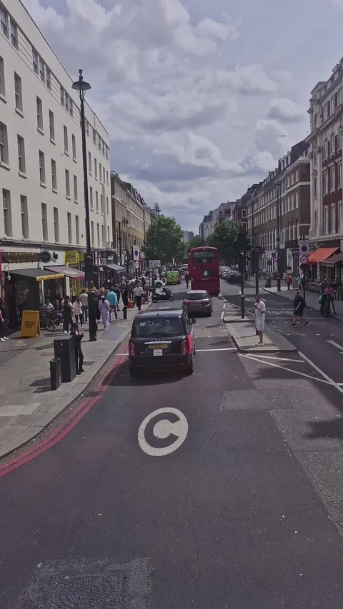 Vertical front person view (fpv) of London red double decker route in London Stock Footage 314974212