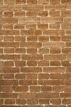 Vertical front view of brown brick wall Stock Photos