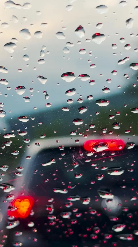 Vertical full HD footage of view through car windshield with rain drops on it Stock Footage 280693891