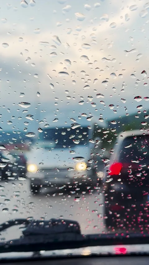 Vertical full HD footage of view through car windshield with rain drops on it Stock Footage 280693936