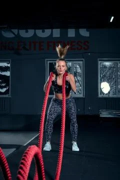 Vertical full length shot of an athletic fitness woman doing functional training Foto stock