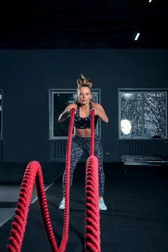 Vertical full length shot of an athletic fitness woman doing functional training Foto stock