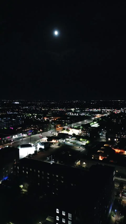 VERTICAL FULL MOON OVER THE CITY NIGHT Stock Footage 248578090