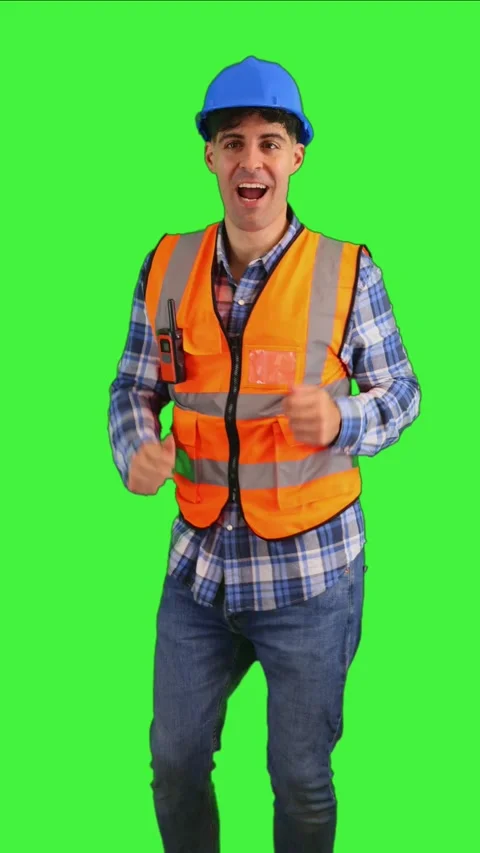 Vertical Funny construction worker dancing joyfully while wearing an orange.. Stock Footage 287328149