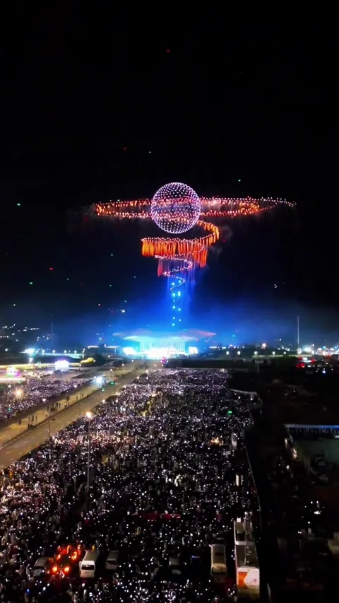 Vertical - Futuristic Drone Sphere Formation and Fireworks Above Crowd Video stock 331760686