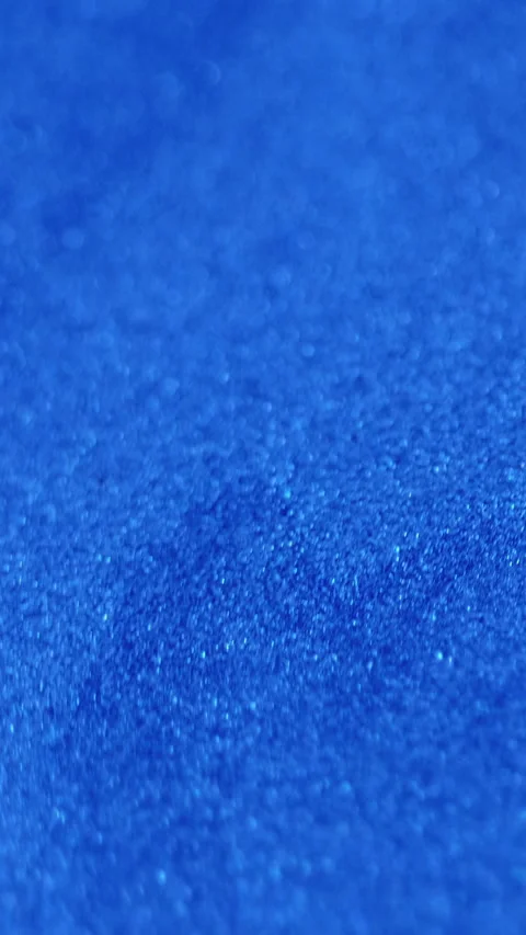 Vertical glitter ink spill sparkling texture blue Video stock 283948596