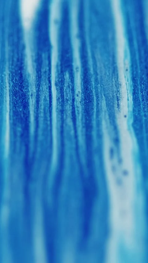 Vertical glitter liquid drip marble blue white ink Video stock 295738662