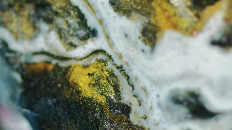 Vertical glitter liquid spill paint drip ink mix Stock Footage 283425928